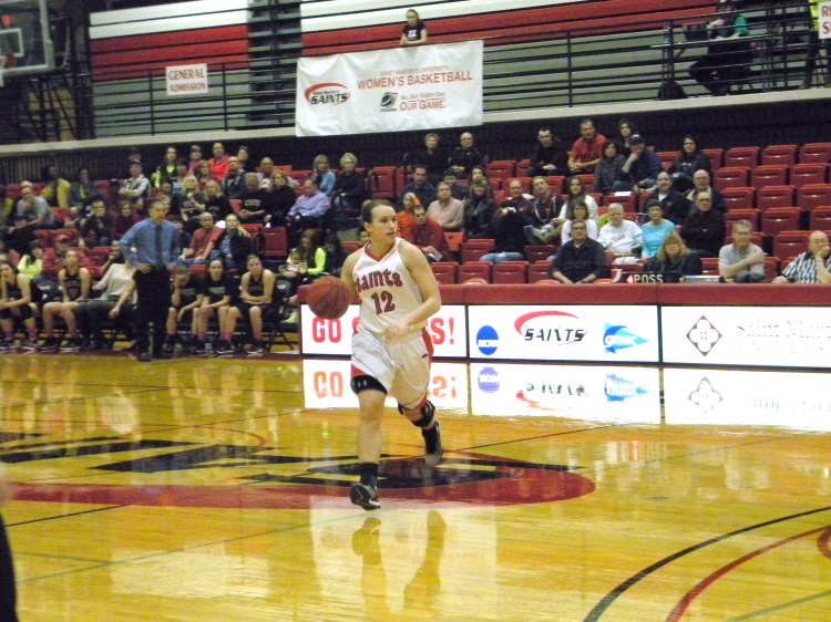 MacKenzie Taylor dribbles down the court